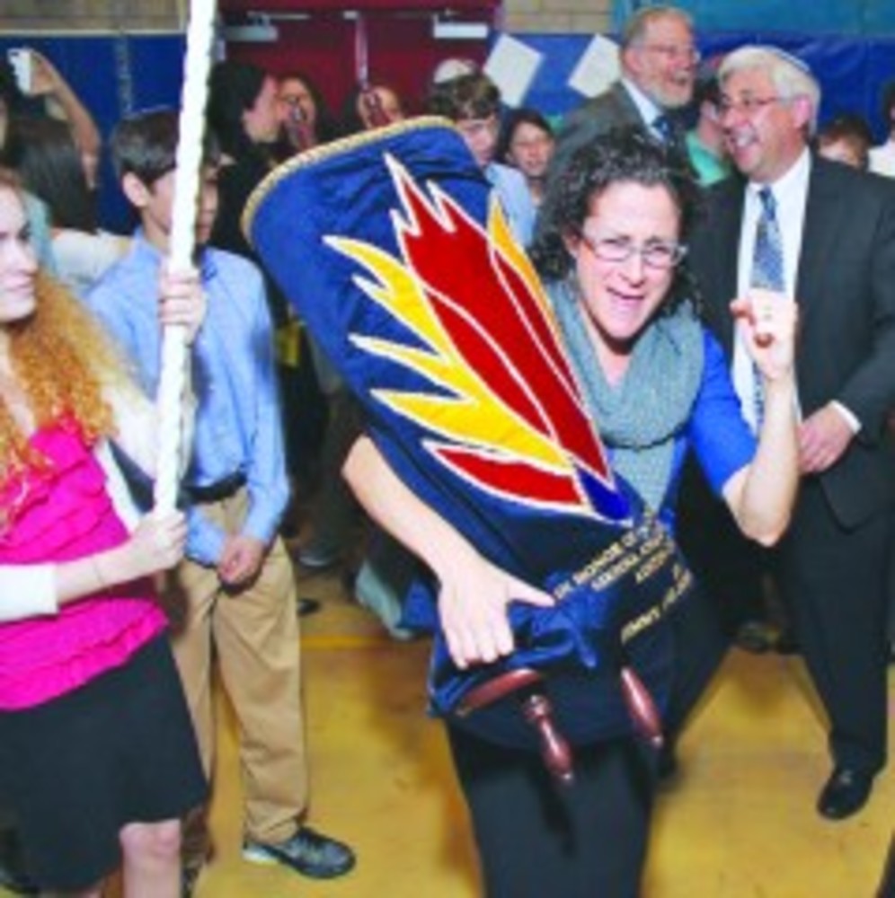 Rabbi Michelle Dardashti is ‘in action’ at a Torah dedication ceremony at the Orthodox community day school, in Stamford, Conn. /Photos | Rabbi Michelle Dardashti